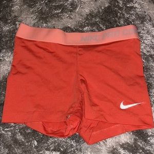 NIKE Pro Orange Shorts.